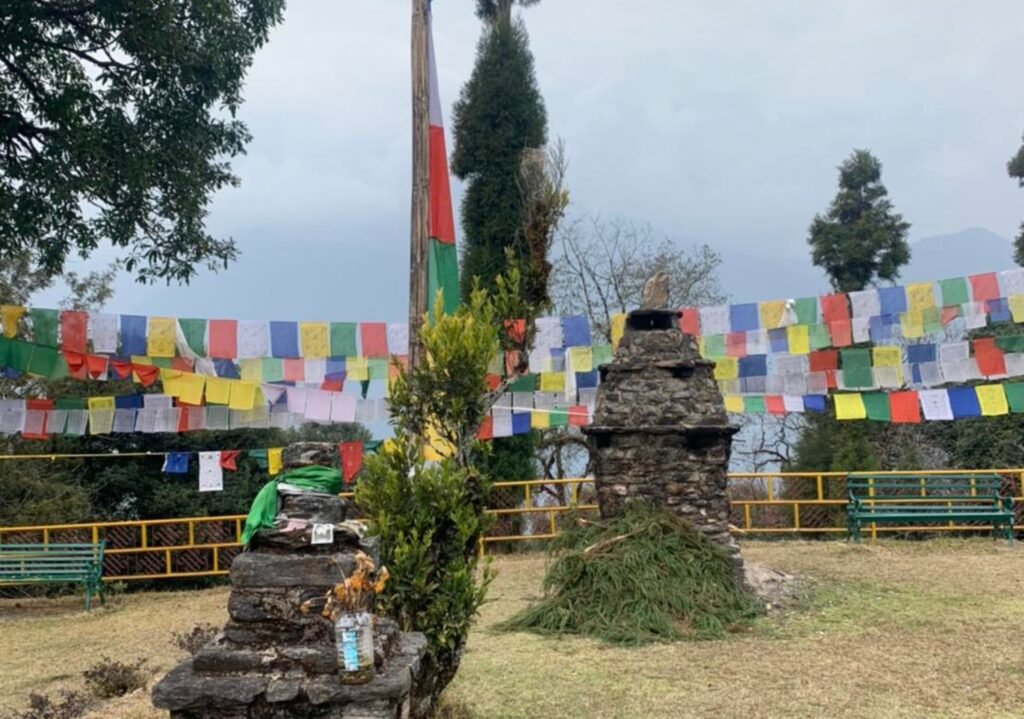 Colorful prayer flags fluttering near Dubdi Monastery, Yuksom