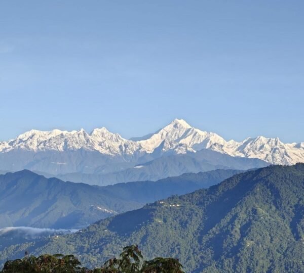 : Sunrise view of Mount Kanchenjunga from Thambi View Point near Zuluk